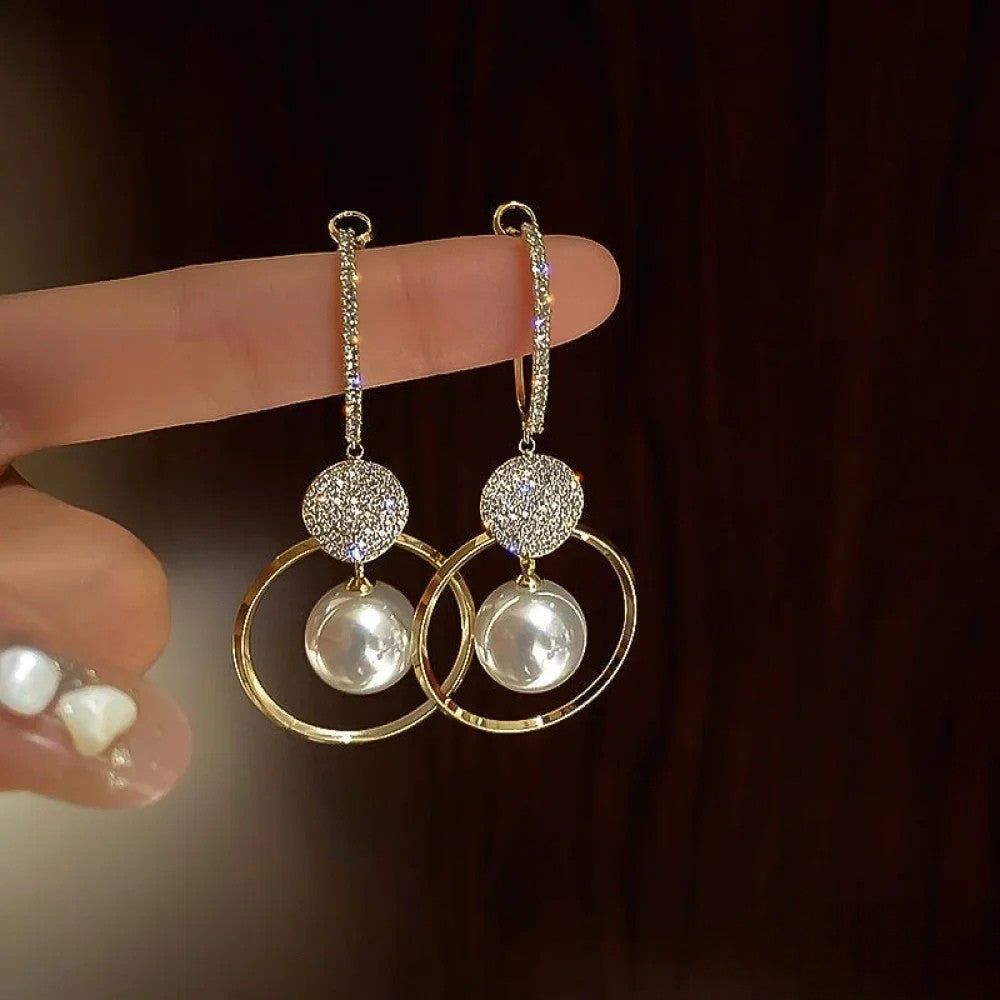 Elegant earrings with cultured pearls and sparkling zirconia