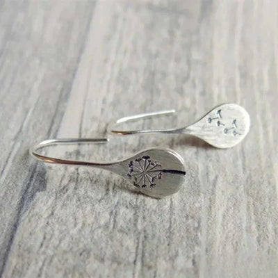 Elegant silver earrings in dandelion leaf design