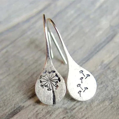 Elegant silver earrings in dandelion leaf design